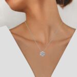 white gold diamond cluster pendant on model